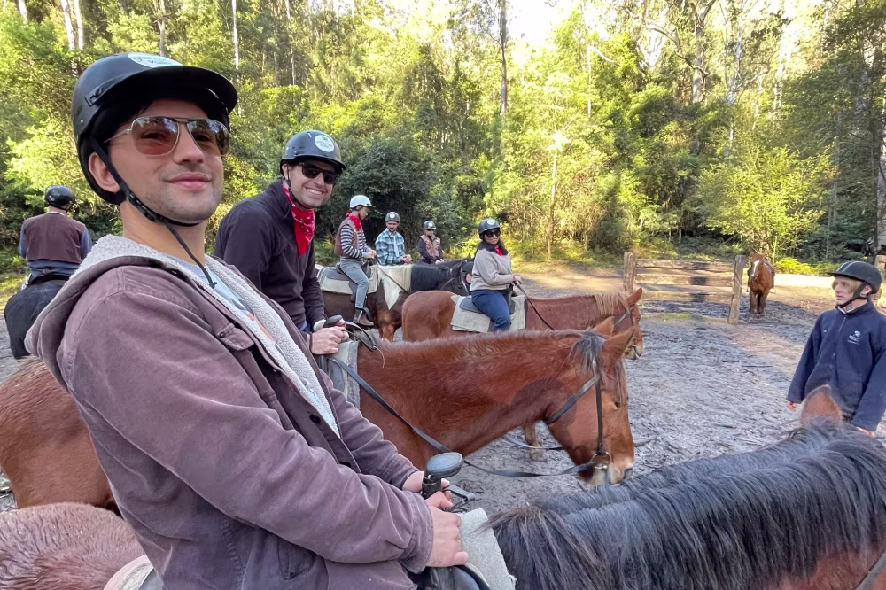team members doing horse riding